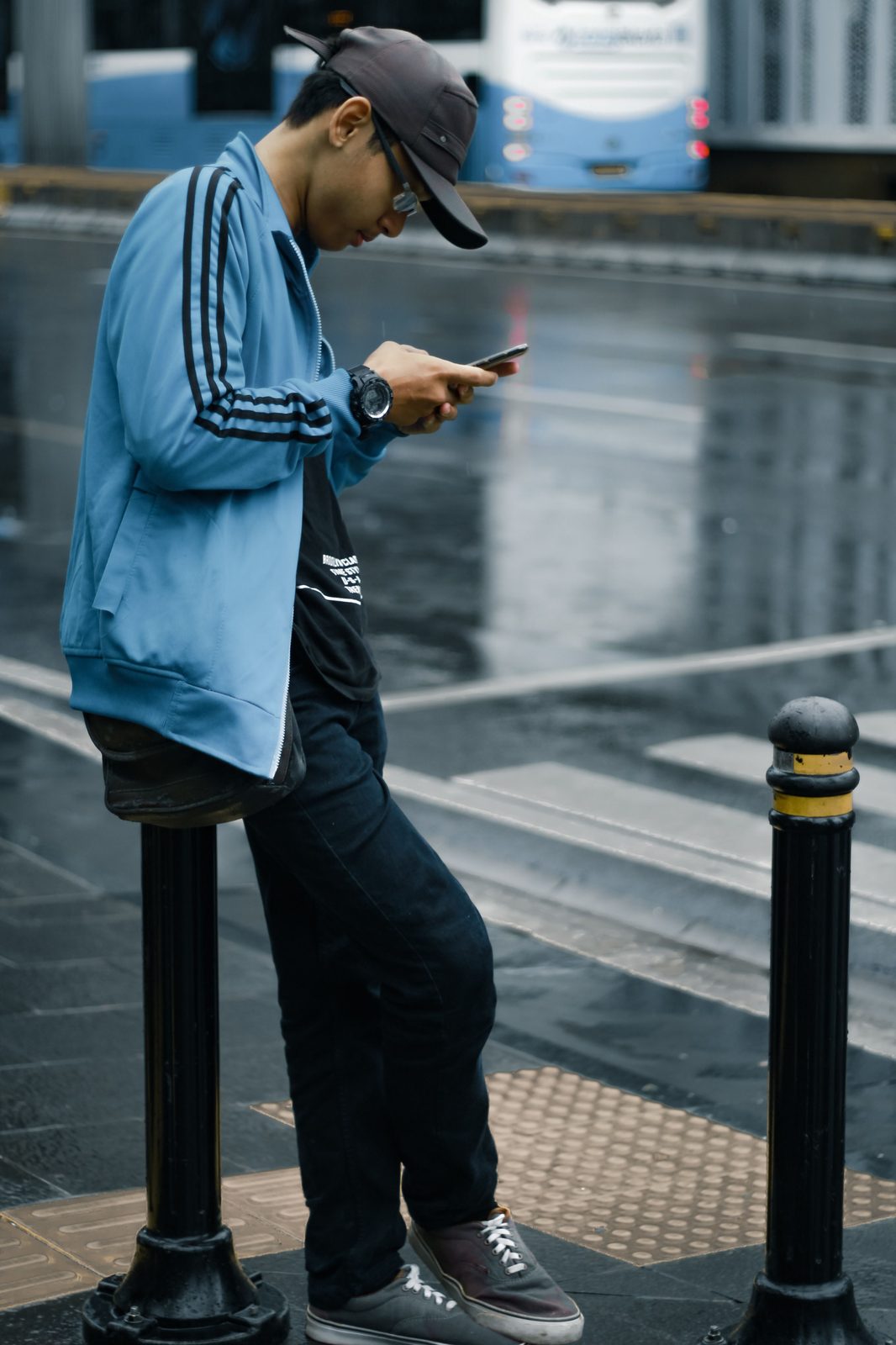 A person checking their phone while waiting